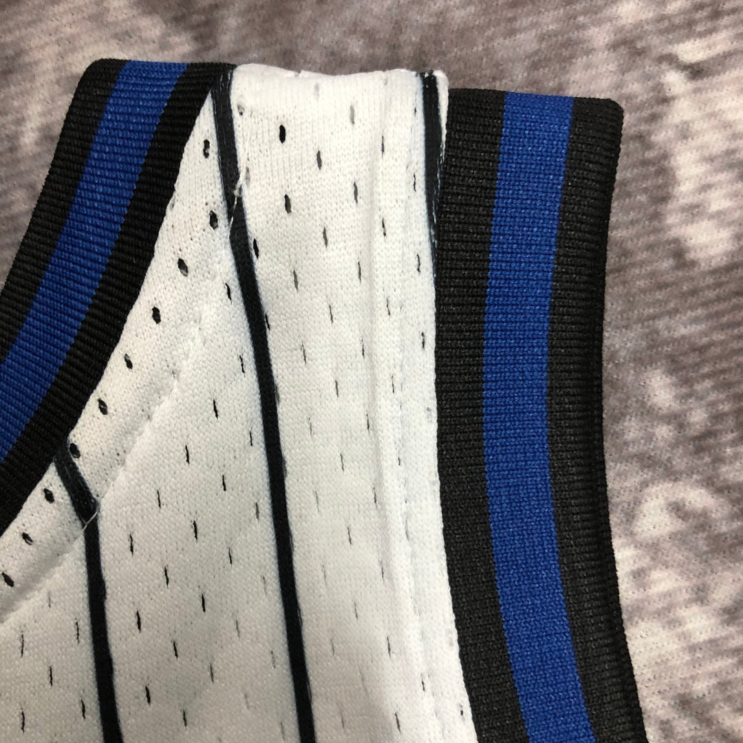 Regata Mitchell & Ness Orlando Magic Shaquille O’Neal 1994-1995 Branca